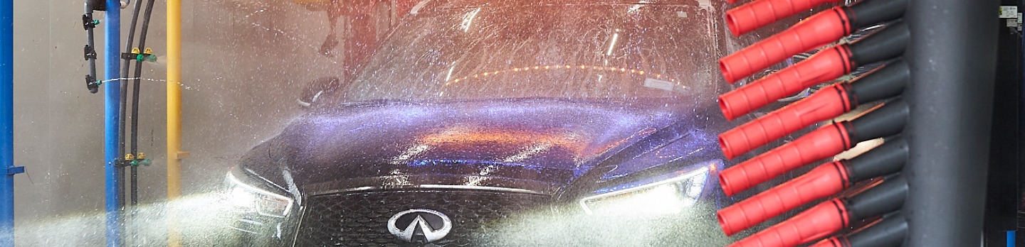 Car getting blasted with water in a carwash